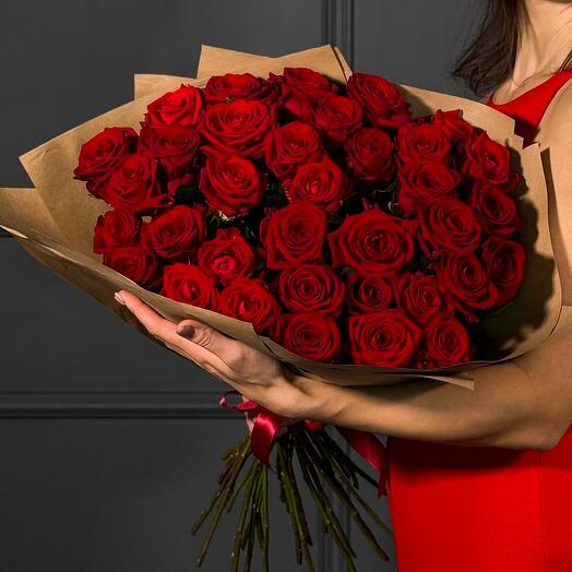 A bouquet of 35 red roses in a craft package