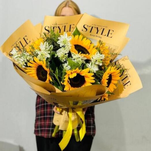 A luxurious bouquet of flowers with sunflowers