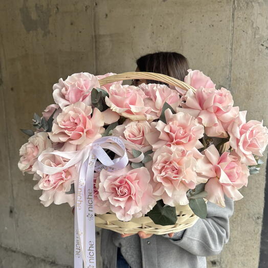 Pink French roses in a basket
