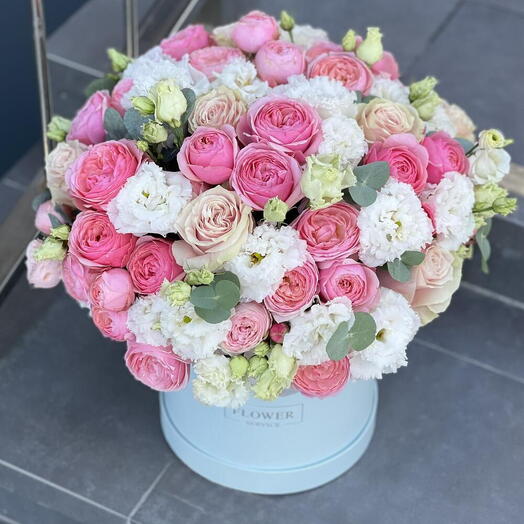 Composition of a peony-shaped bush rose and eustoma to a cute coquette