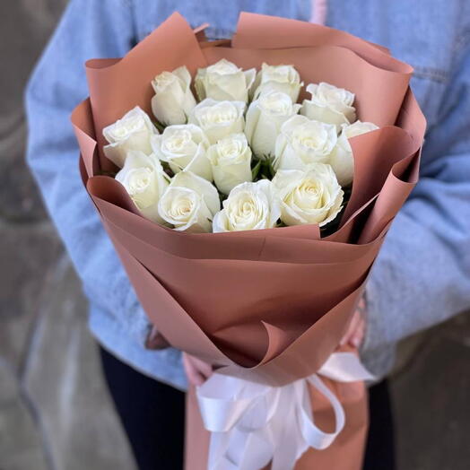 15 white roses in the design