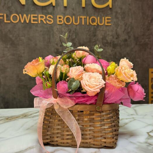 Basket with bushy peony-shaped roses
