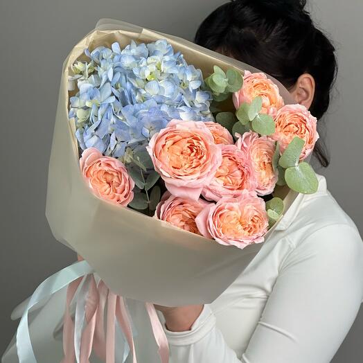 Delicate bouquet with hydrangea and bushy peony-shaped roses