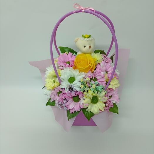 Composition of roses, chrysanthemums and gypsophila Flowers in a handbag with a toy 7