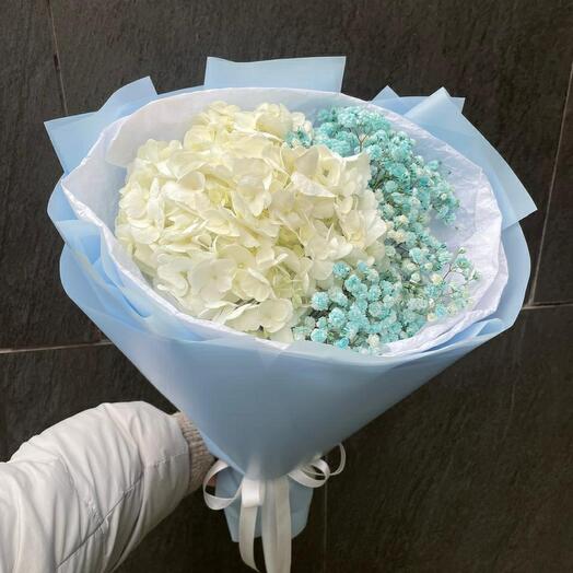 A compliment bouquet of white hydrangea and gypsophila