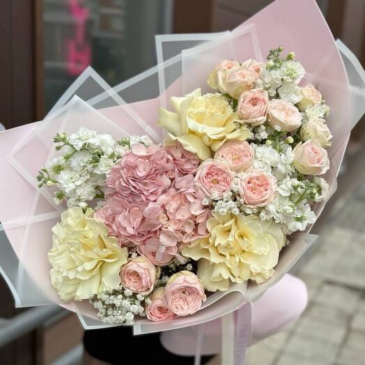 A large bouquet with hydrangea, peony-shaped bush roses, mattiola , French white roses and gypsophila