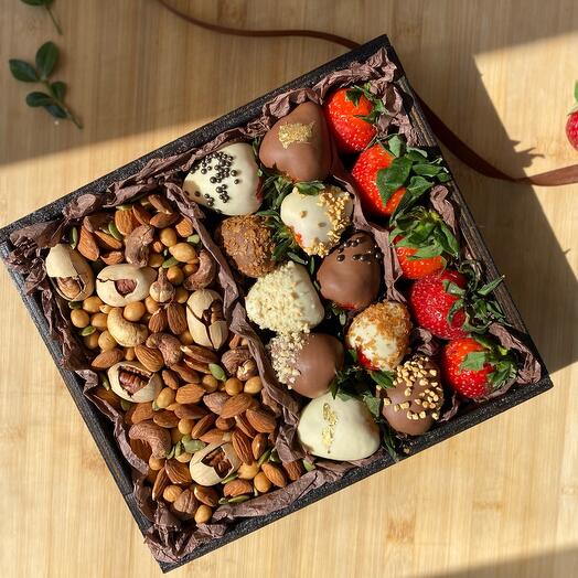 Box with chocolate-covered strawberries, nuts and classic berries (strawberries)