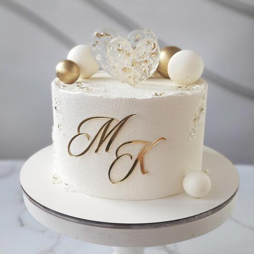 Wedding cake with hearts and chocolate balls