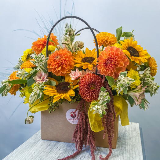 Sunflowers and dahlias in a handbag