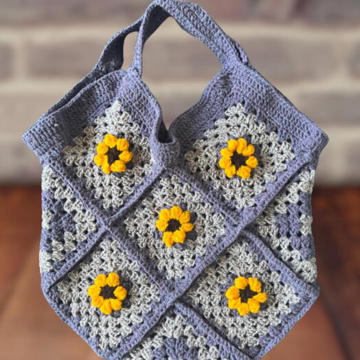 Purple and yellow daisy crocheted bag