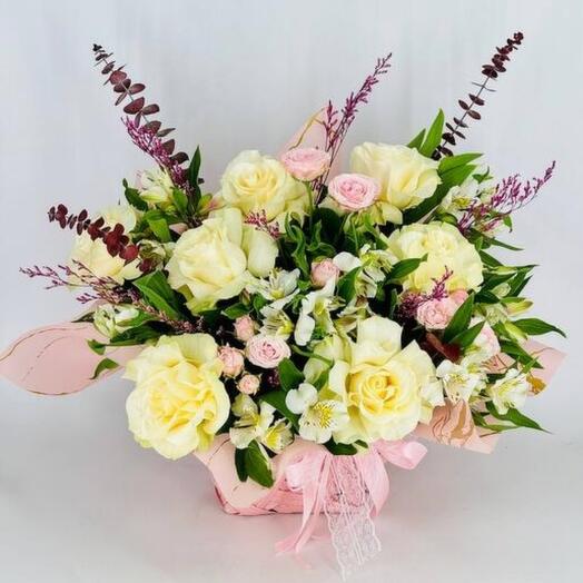 Wicker planter Basket with flowers and French roses