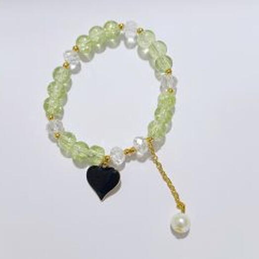 Light green beads bracelets with heart cha
