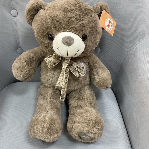 Коричневый мишка с бантом
