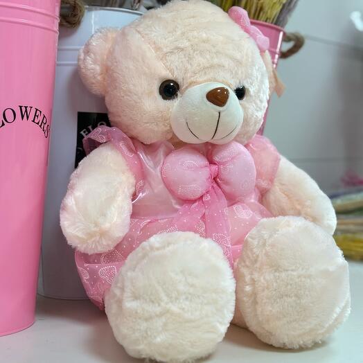 Плюшевый медведь в розовом платье