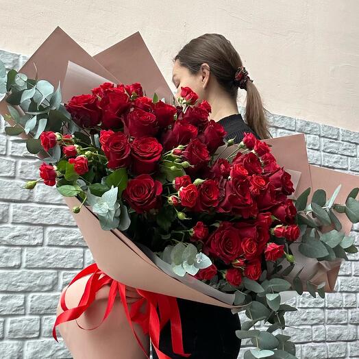 Bouquet of Ecuadorian and bush roses with eucalyptus