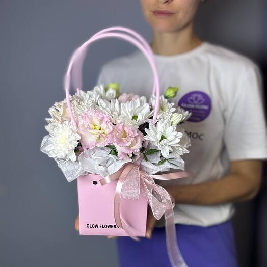 Bouquet with eustoma and chrysanthemum in a handbag