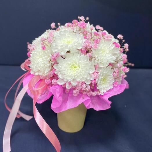 The composition in the cup is a bush chrysanthemum and a pink gypsophila