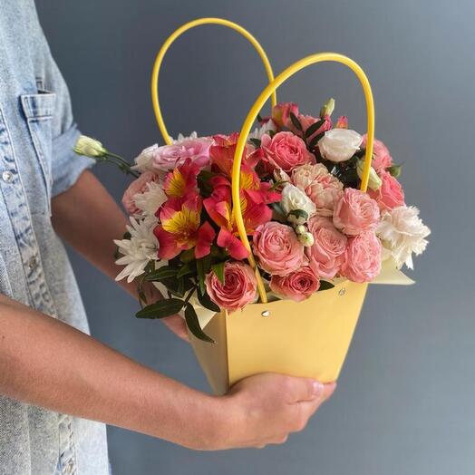 A bright bag with bush roses and alstroemeria
