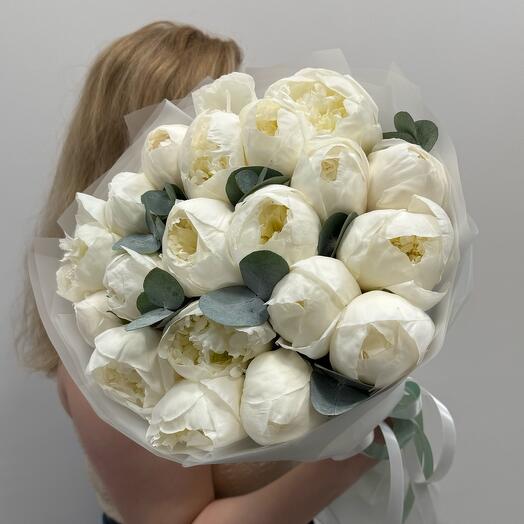 White peonies with eucalyptus in a fragrant bouquet