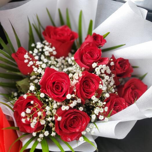 Red roses bouquet with white cover