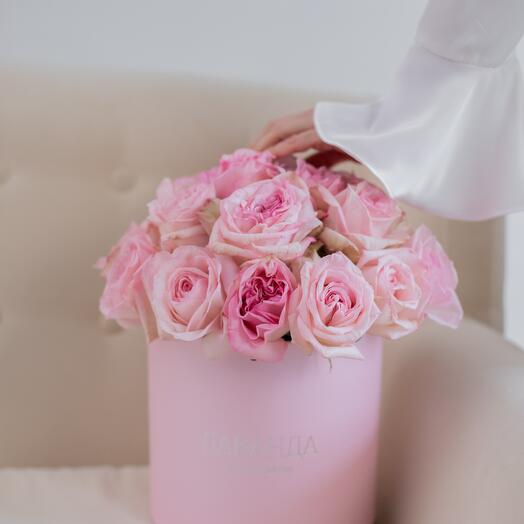 Pink peony-shaped roses in a box