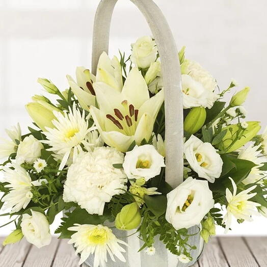 White Beauty: 4 White Lilies, 3 White Estoma, 3 White Spider Chrysanthemums   Seasonal Greens