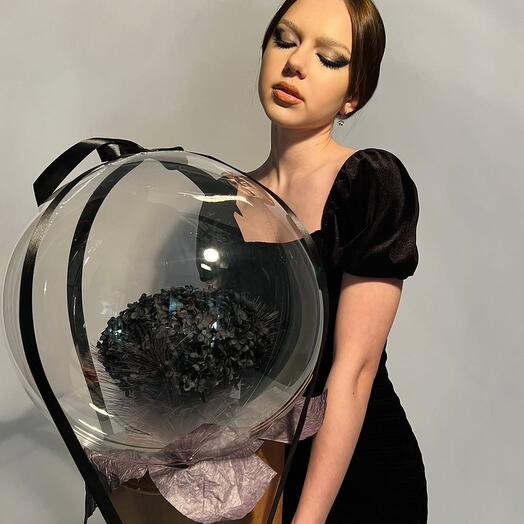 Black swan is a large composition of elegant black hydrangea with feathers in a ball