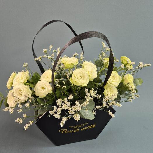 A stylish black handbag with white roses
