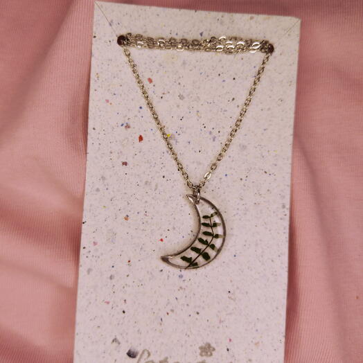 Transparent moon pendant with real plant