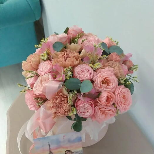 Bouquet of flowers in a box Ecuadorian peony rose, alstroemeria, chrysanthemum, dianthus and eucalyptus