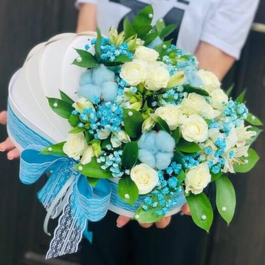 Flowers for the boy's discharge from the hospital in a box cradle