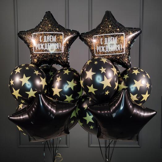 Composición de cumpleaños de globos negros con estrellas