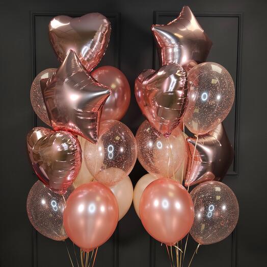 Composition of rose gold balloons with hearts and stars