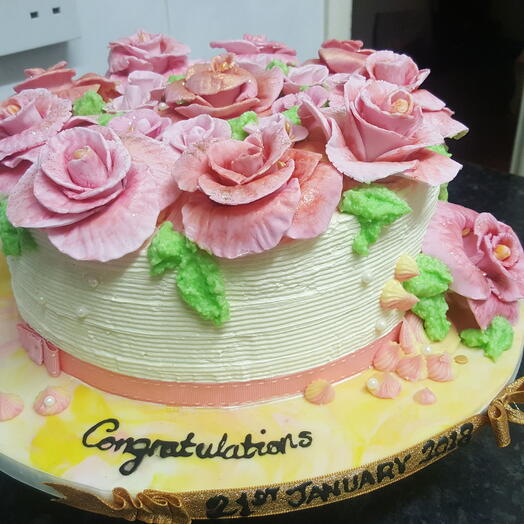 Fondant rose and buttercream celebration cake