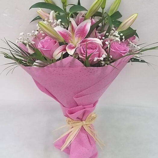 Pink Petal Melody Ensemble: 3 Pink Lilies, 10 Pink Roses   Half Bunch Seasonal Greens