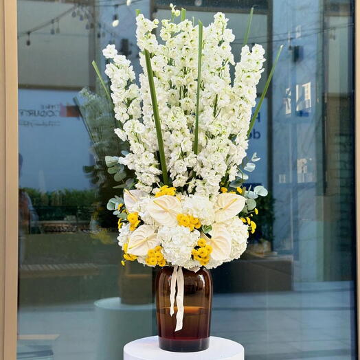 Dolphinum arrangement with mix flowers