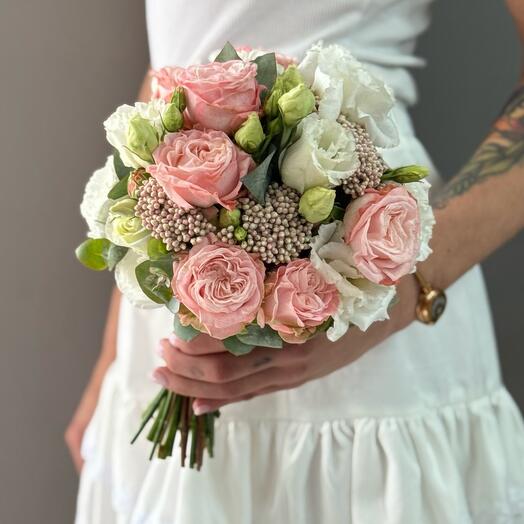 Bridal bouquet of bush peony-like roses and lisianthus