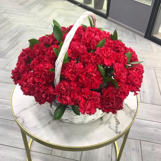 Basket with carnations and herbs