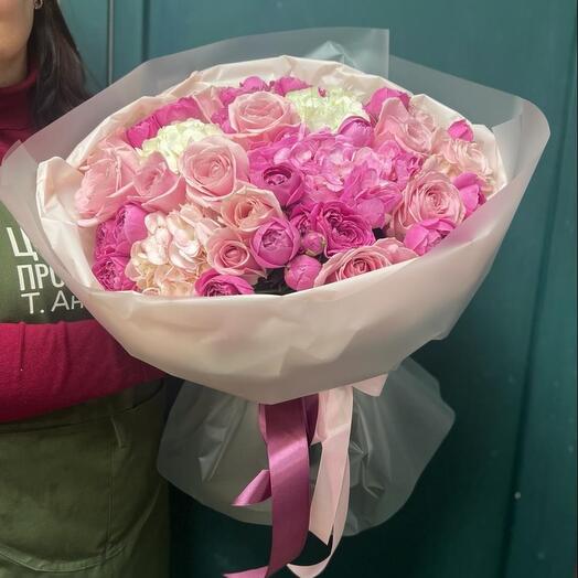 A bouquet of hydrangeas and a bushy peony rose