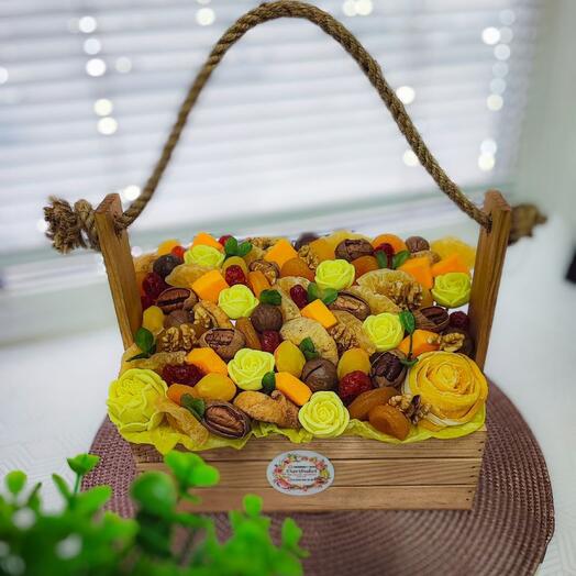 A bouquet of nuts and dried fruits with chocolate flowers