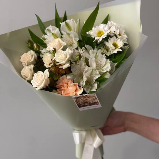 A delicate spring bouquet with a bush rose