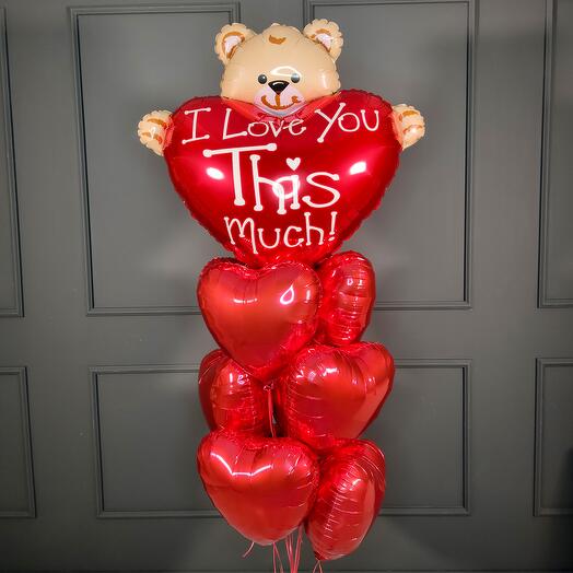 Composition red hearts and a bear