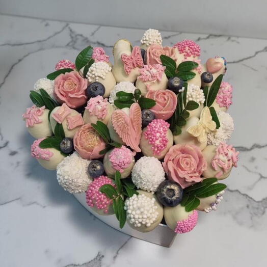 Heart of chocolate-covered strawberries and berries