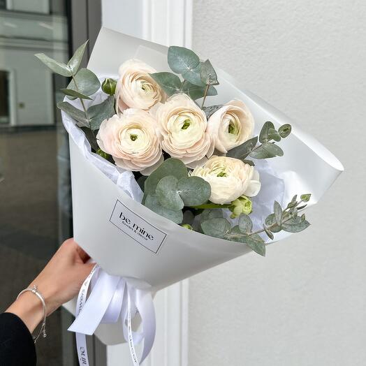 Ranunculus with eucalyptus in a white package