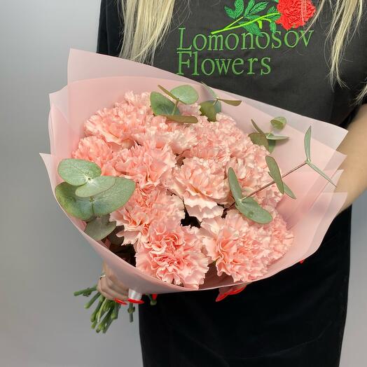 Bouquet of delicate pink carnations and eucalyptus