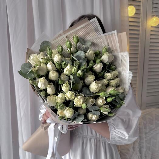 Bouquet of bush roses with eucalyptus twigs