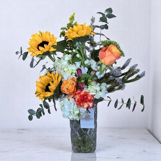 Crystal Elegance Bouquet with Sunflowers, Hydrangeas   Orange Roses in Premium Glass Vase