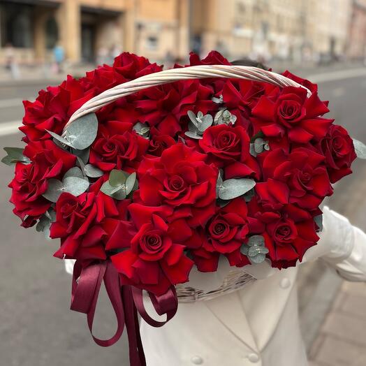 A basket of burgundy French roses