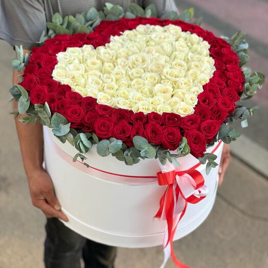 A heart of roses with eucalyptus in a box