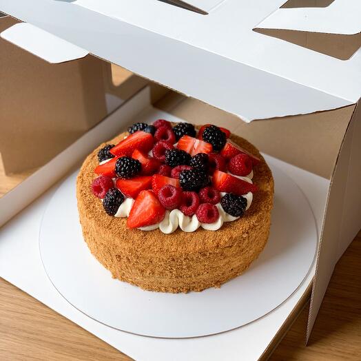 Honey cake with berry decor